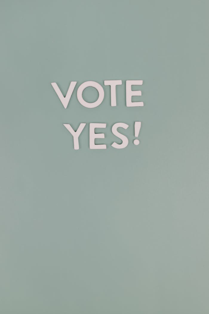 Minimalistic image with 'Vote Yes' text on a green background, ideal for political or motivational themes.